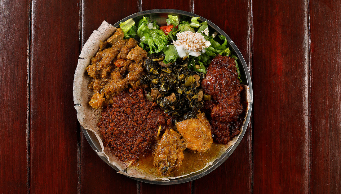 Meat combination plate with Sega Alicha, minchet wot, doro alicha, and sega alicha